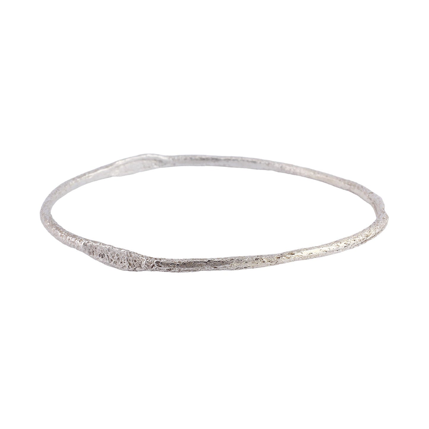 Angled view of Bhangra Bangle in sterling silver by Betsy Barron