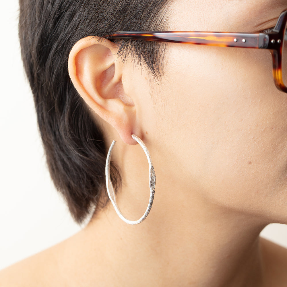 Model wearing Tonia Hoop earring in right ear
