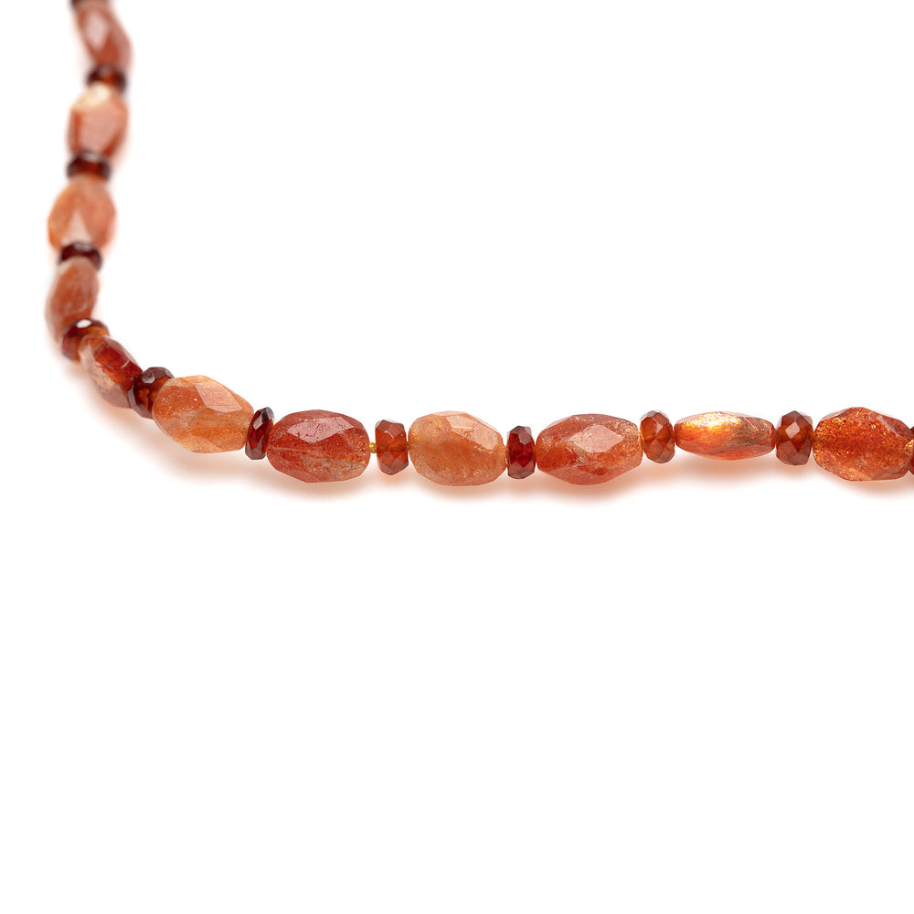Detail view of Vacation Necklace with goldstone garnet beads