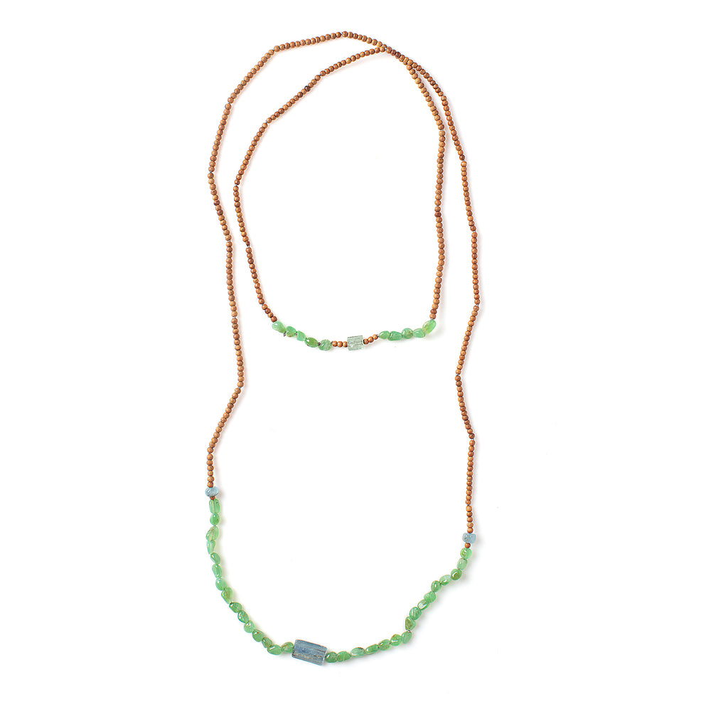 Top-down view of Vacation Necklace with pebble green garnets