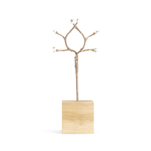 Bronze double hair stick with white pearl buds, shown in wood block display