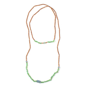 
            
                Load image into Gallery viewer, Top-down view of Vacation Necklace with pebble green garnets
            
        